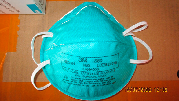 This December 2020 image provided by U.S. Immigration and Customs Enforcement (ICE) shows a counterfeit N95 surgical mask that was seized by ICE and U.S. Customs and Border Protection.