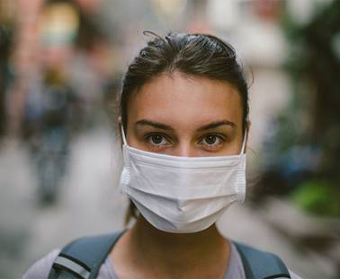 Woman wearing a face mask.