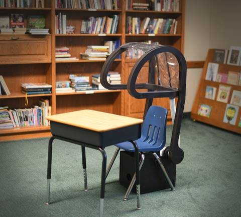 The IsoBooth Student assembly attaches to most standard school chairs and is lightweight and easy to use.
