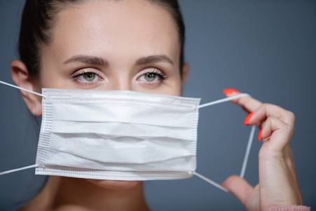 Computer modelling by researchers in the US reveals that standard recommended face masks have more leaks when used by women. Photo: Shutterstock