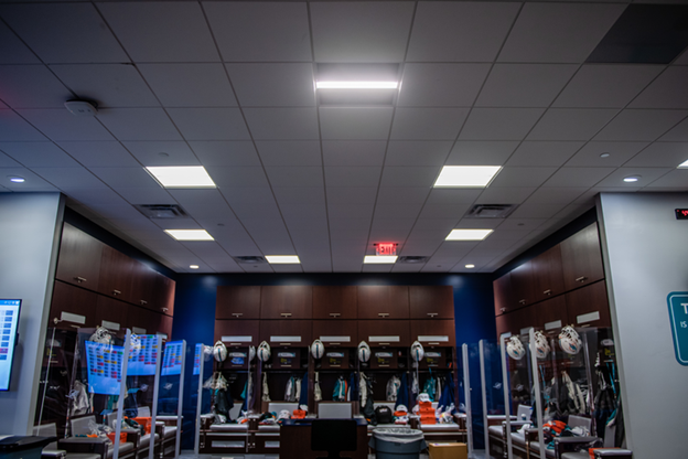 The National Football League's Miami Dolphins are running an innovative air game inside the locker room, where about 40 Healthe ceiling troffers, such as the one in the middle foreground of the ceiling in this photo, are equipped with a filtration system and Crystal IS UV-C LEDs to attack the SARS-CoV-2 virus. (Photo credit: Image courtesy of Healthe Inc.)